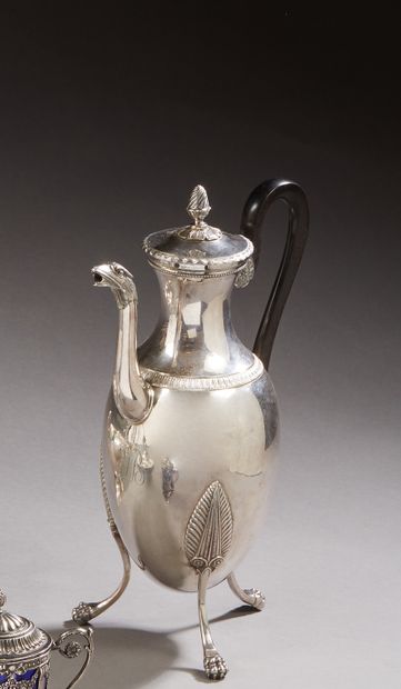 null PARIS 1800 - 1809

Silver tripod coffee pot. It stands on three claw feet with...