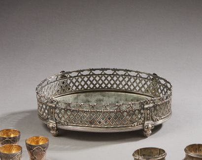 null Oval silver centerpiece with openwork border of trellises, garlands of leaves...
