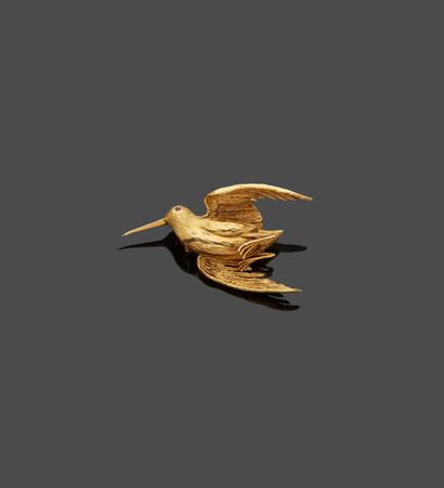 null Woodcock brooch in yellow gold, the eye set with a small ruby (deformation of...