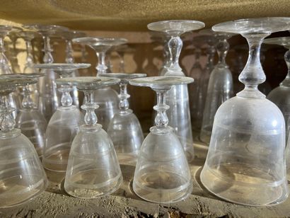 null Part of a service of crystal glasses with feet decorated with two bands engraved...