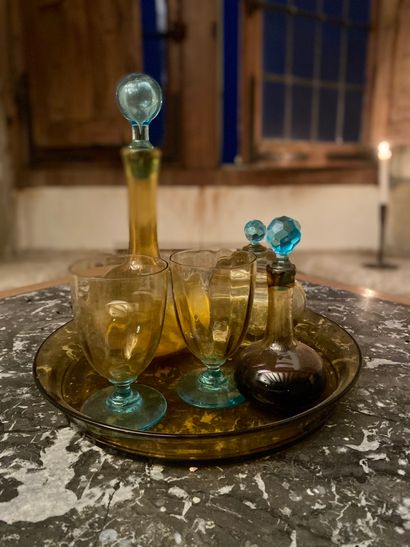 null Yellow and blue tinted glass water set including two flasks, a covered cup and...
