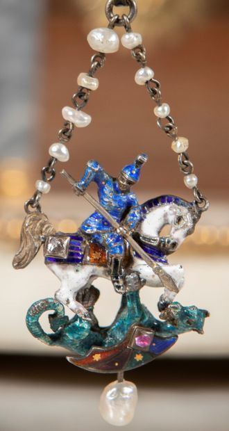 null 
Polychrome enamelled silver pendant representing Saint George slaying the dragon....