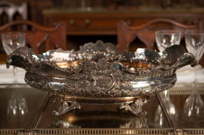 null 
Silver plated metal centerpiece with rich rocaille decoration resting on four...