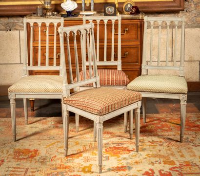 null 
Suite of four grey lacquered wood chairs with openwork fluted colonnade back,...