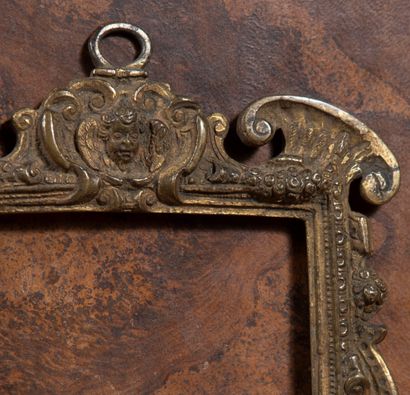 null 
Chiseled bronze frame with old traces of gilding decorated with angels' heads,...