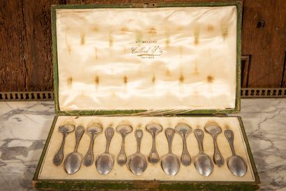 null 
Twelve small silver coffee spoons, the handle decorated with acanthus leaves,...