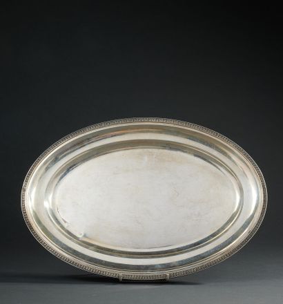 null Oval silver dish decorated with a frieze of water leaves.

Empire style

Length...