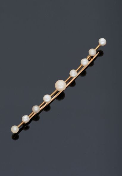 null Brooch barrette in yellow gold 18 k (750 thousandths) set with nine pearls "buttons"...