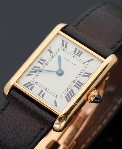null CARTIER - Bracelet watch in 18k yellow gold (750 thousandths), tank case, white...