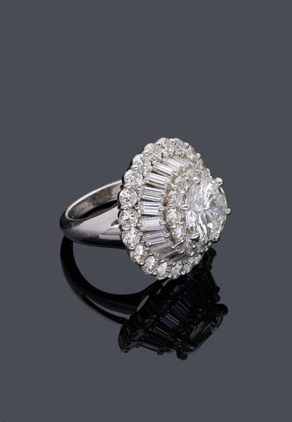 null 
MAUBOUSSIN SET - Platinum ring set with a diamond weighing 3.38 carats within...