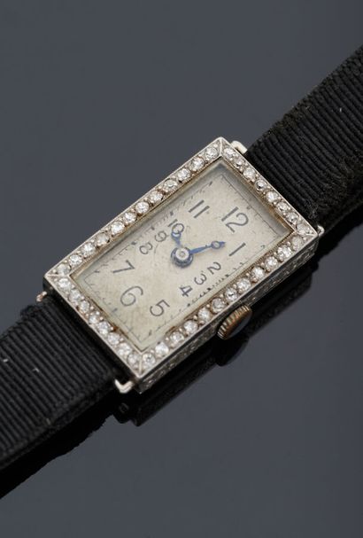 null Rectangular platinum ladies' evening watch set with diamonds, the sides engraved...