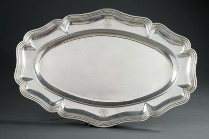 null Large oval silver dish with scalloped edges underlined by nets, engraved with...