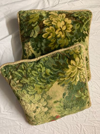 A pair of cushions in velvet pinned in imitation...