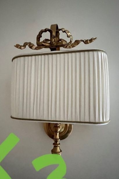 null 
Three Louis XVI style sconces, one of which is smaller 
