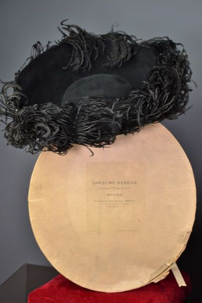 null Hat by CAROLINE

REBOUX. Haute couture fall winter - circa 1943

The model is...