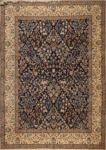Wool and silk carpet with black field decorated...