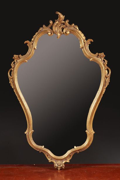 Louis XV style mirror in carved and gilded...