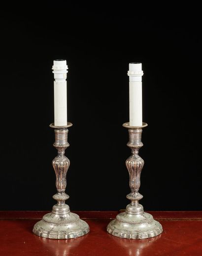 null Pair of silver plated bronze torches, bases with contour and baluster shaft....