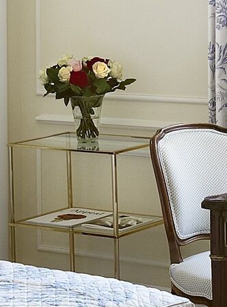 null Pair of rectangular tables in gilded metal with three glass tops. Fluted uprights...