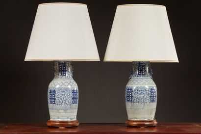 null Pair of white and blue porcelain vase lamps decorated with ideograms. Carved...