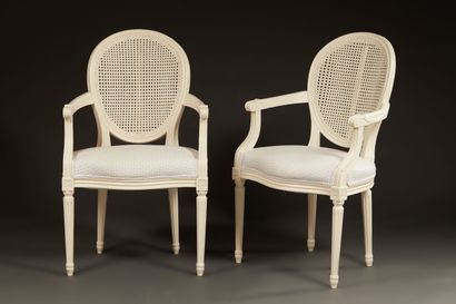 null Pair of Louis XVI style cabriolet armchairs in gilded lacquered patinated wood....