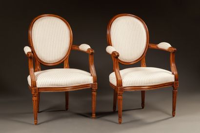 null Pair of Louis XVI style cabriolet armchairs in cherry wood. Backs medallion....