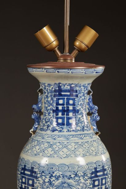 null Pair of white and blue porcelain vase lamps decorated with ideograms. Carved...