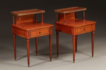null Pair of bedside tables with two trays in stained wood mahogany and brass fillet,...