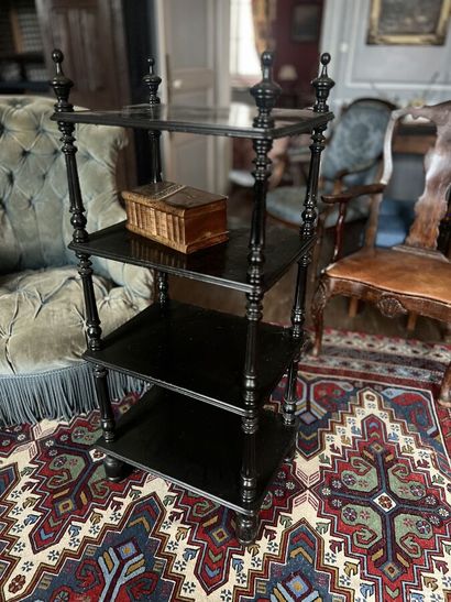 null Black lacquered wood shelf with four superimposed molded trays, turned and fluted...