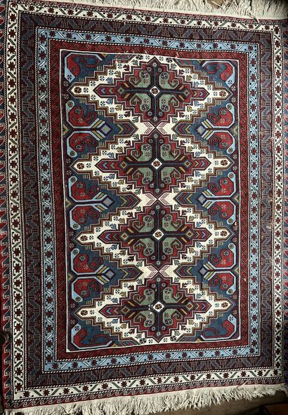 Caucasus carpet with blue, green and red...