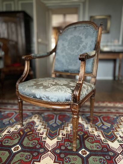 Armchair with a flat basket handle back called...