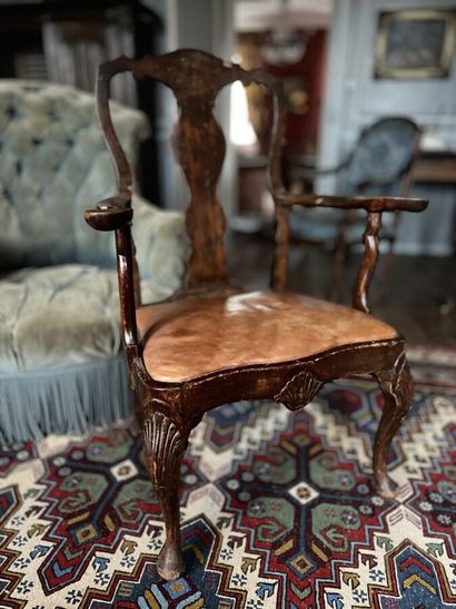 null Armchair in wood veneer, openwork back decorated with shells, cambered foot,...