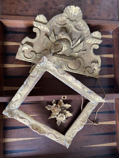 Three elements in carved and gilded wood...