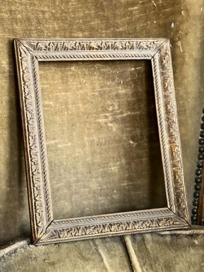 Carved and gilded wood frame decorated with...