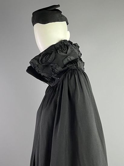 Cape with large floral collar declawed evoking...