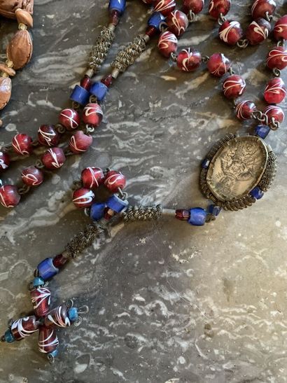 null Two antique rosaries including a metal rosary and amber beads ended by a reliquary...
