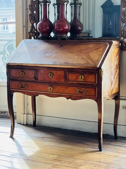 null Veneer sloping desk opening with a flap and three drawers with marquetry decoration...