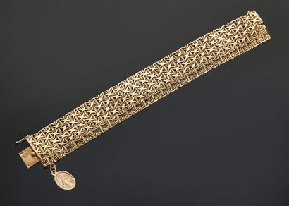null Bracelet articulé en or jaune 18 k (750 millièmes), porte une petite médaille...