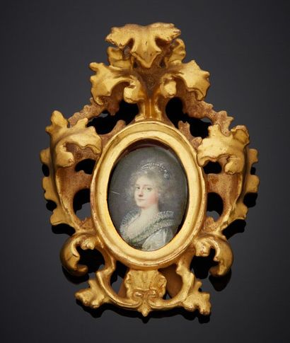 Carved and gilded wood frame in the form...