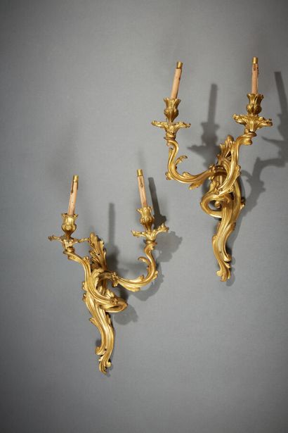 A pair of Louis XV-style ormolu sconces with...