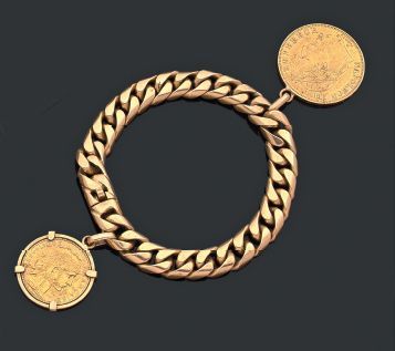 null BRACELET GOURMETTE en or jaune 18k (750 millièmes) à décor de deux pièces en...