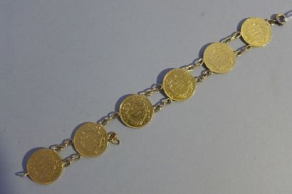 null Bracelet en or jaune 18 k (750 millièmes) composé de six pièces de 20 francs...