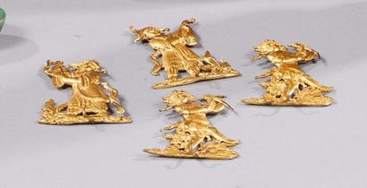 null Quatre porte-miniature en bronze ciselé et doré à décor de putti jouant de la...