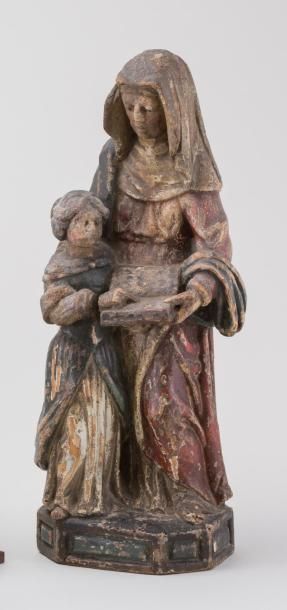 null Sculpture en bois sculpté polychrome représentant l'Education de la Vierge par...