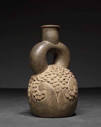 Vase with a handle decorated with waves 
The...