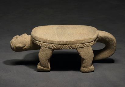 Ceremonial metate with human head 
This small...