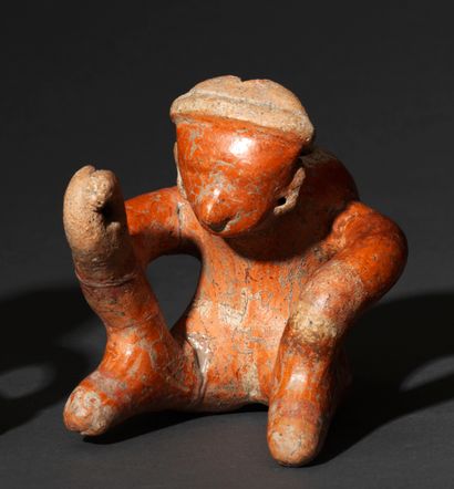 Seated hunchbacked figure 
Brown terracotta...
