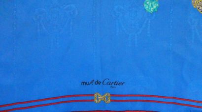 null CARTIER
Silk crepe square with "Must de Cartier" blue background and brooch...