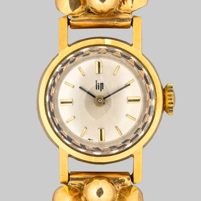 null LIP
Tank ladies' wristwatch, case and bracelet (?) 750 thousandths gold, mechanical...