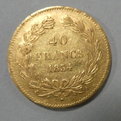null FRANCE. Pièce de 40 francs or Louis-Philippe 1834 A. Poids : 12,9 g. VENDUE...